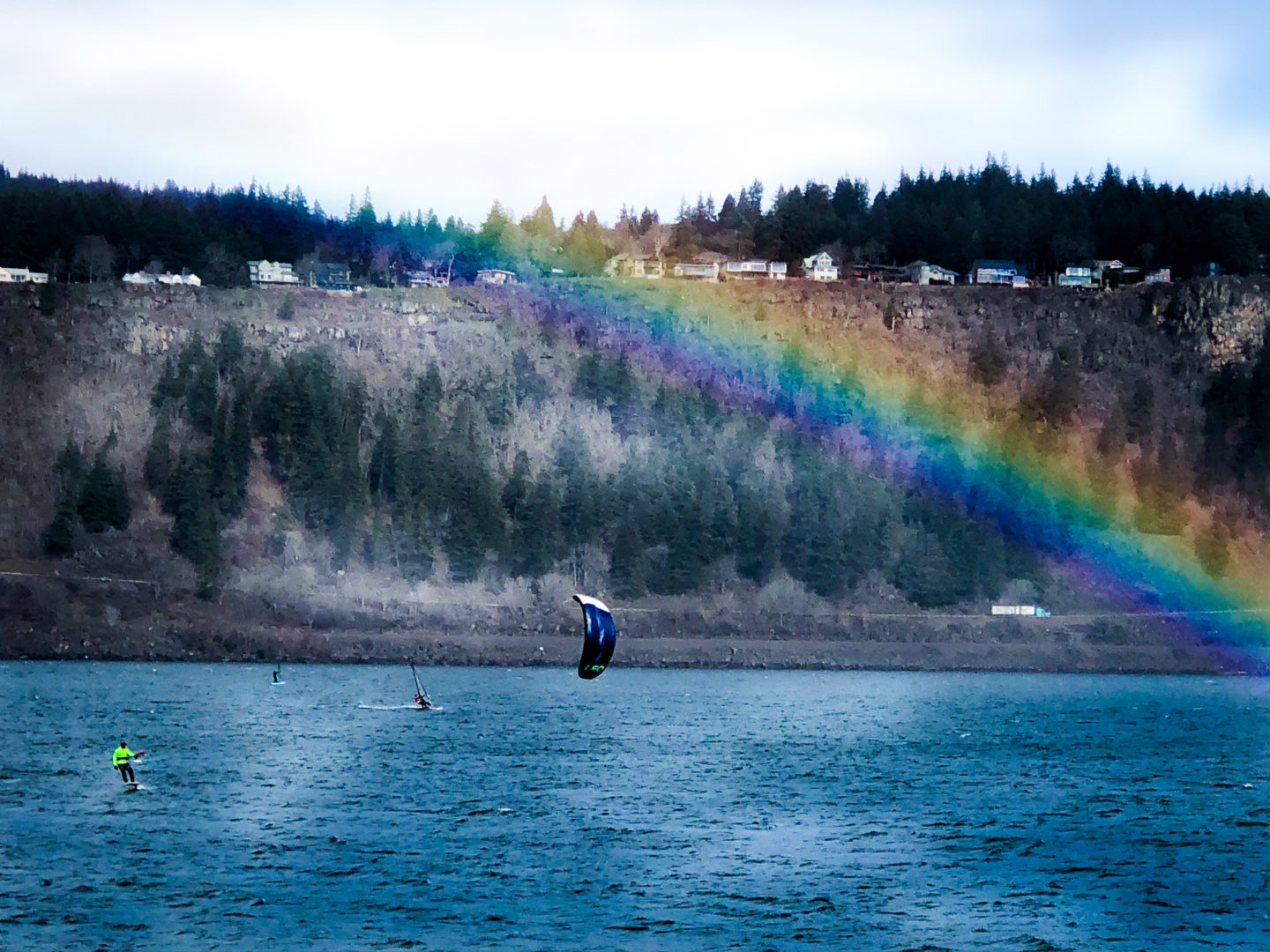 Kiteboarding on the Columbia River under a Rainbow