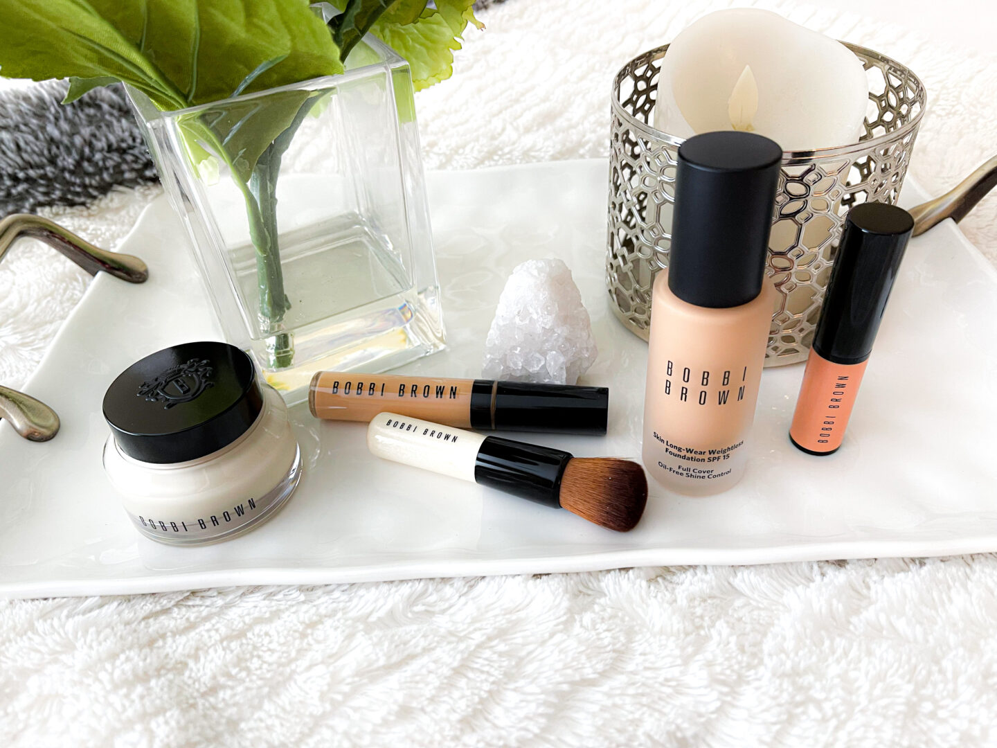 Bobbi Brown Cosmetics Complexion Routine sitting on bed tray.